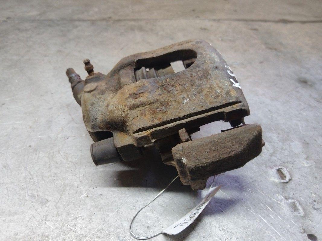 Суппорт передний левый Q1HMXZ Kia Shuma купить