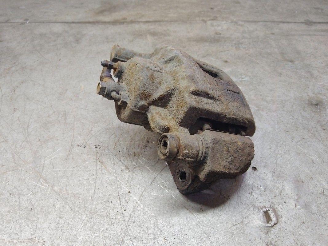 Суппорт передний левый H3N1DK Mazda Premacy купить в магазине запчастей бу