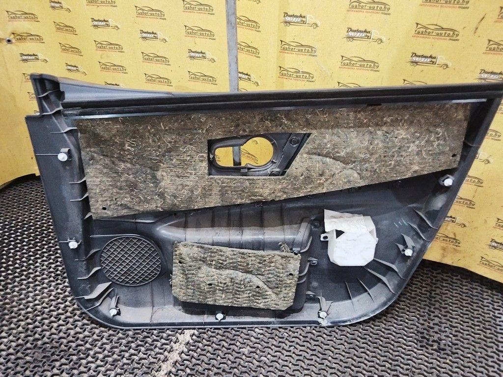 Обшивка двери передней левой (дверная карта) UO8WTJ Nissan Note купить в магазине запчастей бу