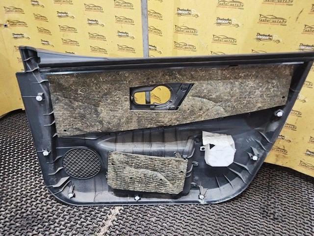 Обшивка двери передней левой (дверная карта) UO8WTJ Nissan Note купить в магазине запчастей бу