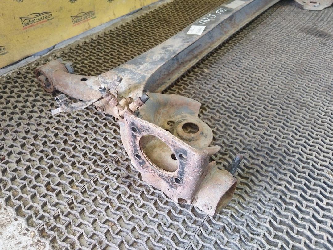 Балка подвески задняя YE2XYF Toyota Yaris купить на авторазборке