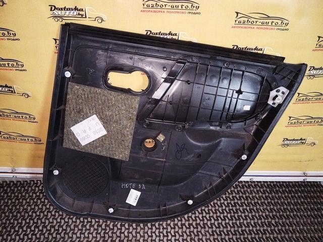 Обшивка двери задней левой (дверная карта) 93H76Z Nissan Note купить