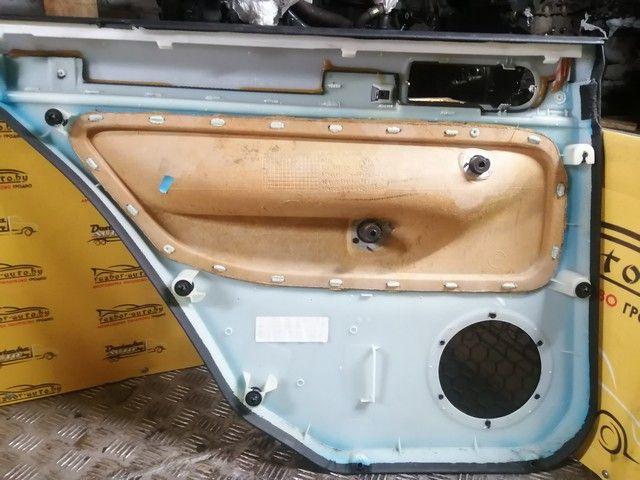 Обшивка двери задней правой (дверная карта) 0L337U Volkswagen Golf купить в магазине запчастей бу