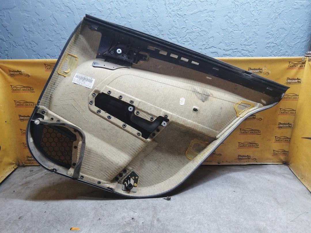 Обшивка двери задней левой (дверная карта) CX5UEL Opel Astra купить в магазине запчастей бу
