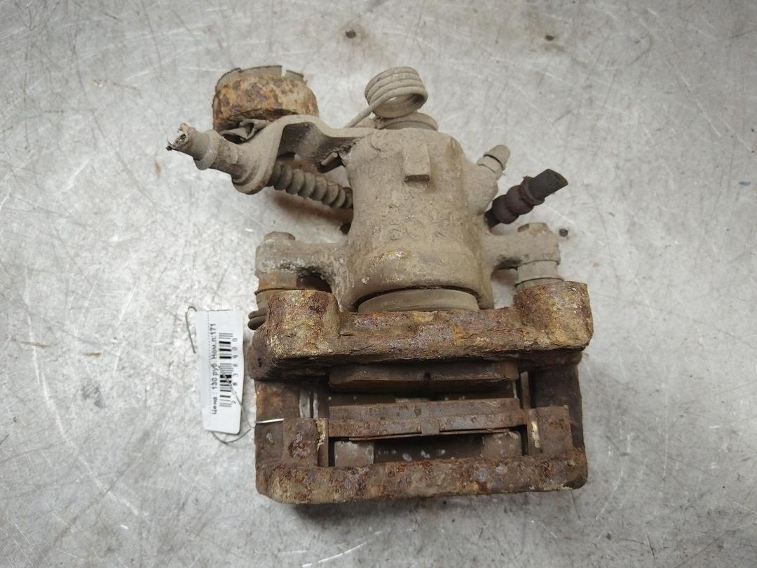 Суппорт задний левый 0W0TYV Opel Zafira купить в магазине запчастей бу