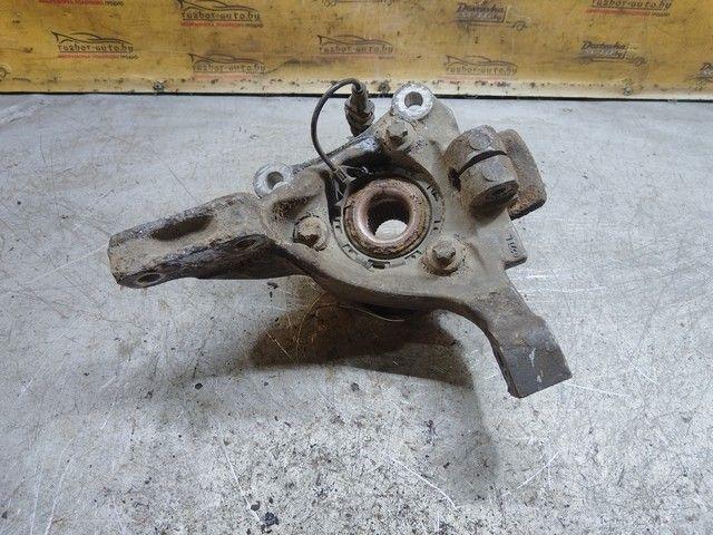 Кулак поворотный левый QXE75N Opel Vectra купить в магазине запчастей бу