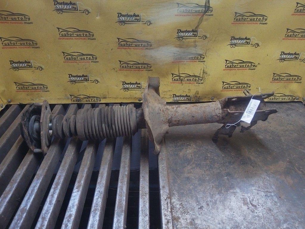 Амортизатор передний левый WBI4N1 Nissan Almera Tino - Фото 1