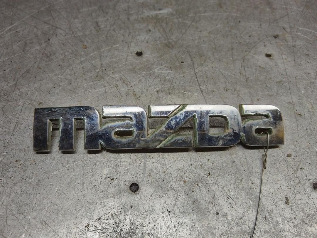 Эмблема 6Y46Y7 Mazda Premacy - Фото 1