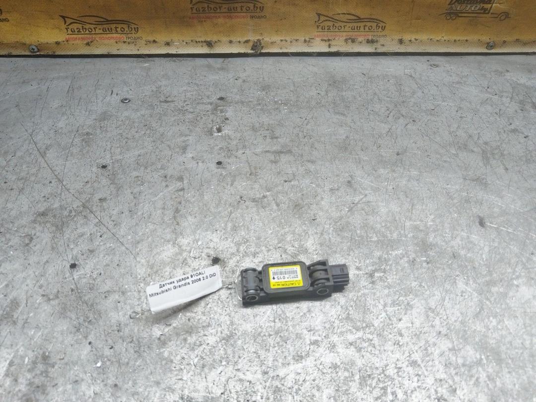 Датчик удара 91OALI Mitsubishi Grandis