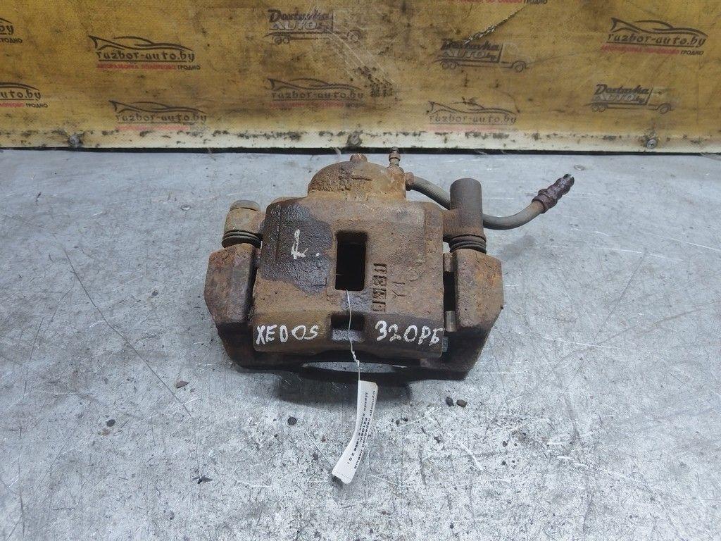 Суппорт передний левый P21G5W Mazda Xedos 6 - Фото 3