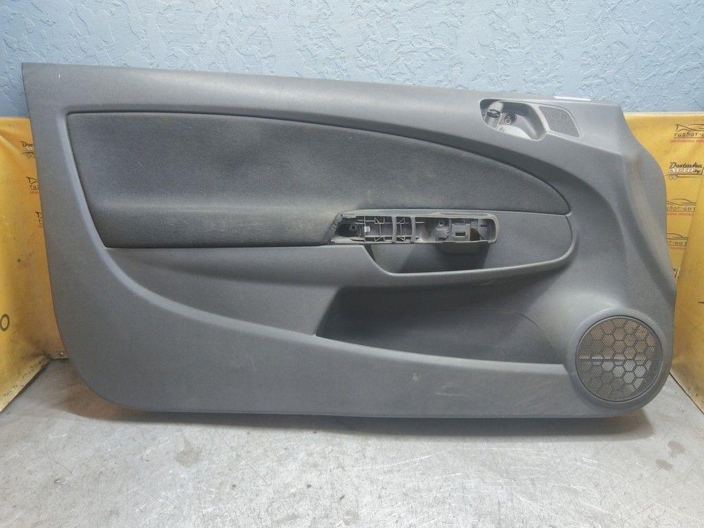 Обшивка двери передней левой (дверная карта) HK41DF Opel Corsa - Фото 1