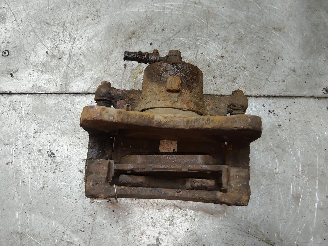 Суппорт передний левый JVZOXG Toyota Corolla купить на авторазборке