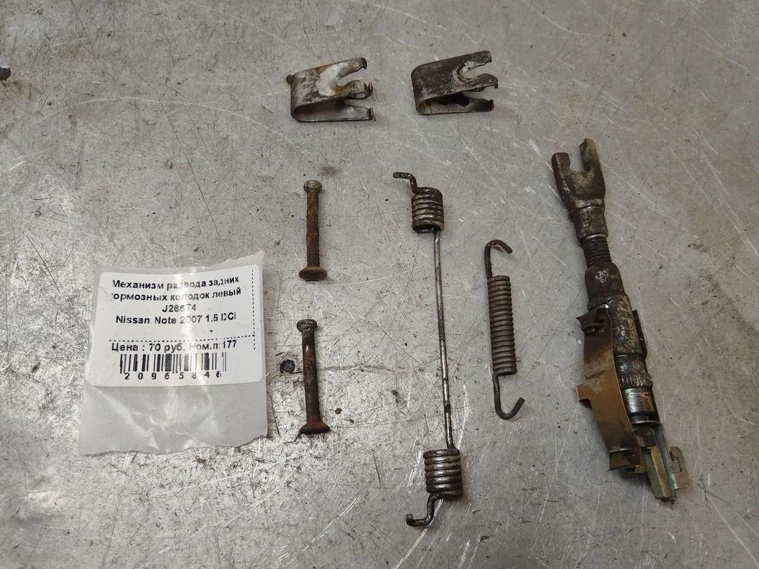 Механизм развода задних тормозных колодок левый J266T4 Nissan Note - Фото 1