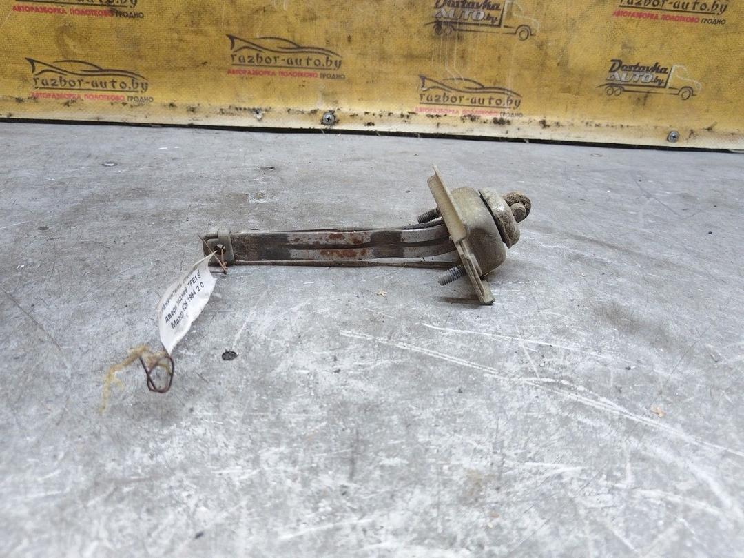 Ограничитель открывания двери задней 7FE1SM Mazda 626 купить на авторазборке