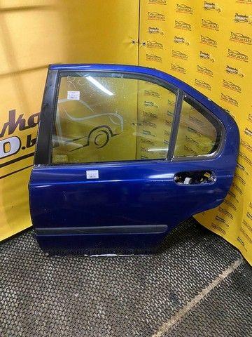 Стекло двери задней левой E9GBSE Rover 400