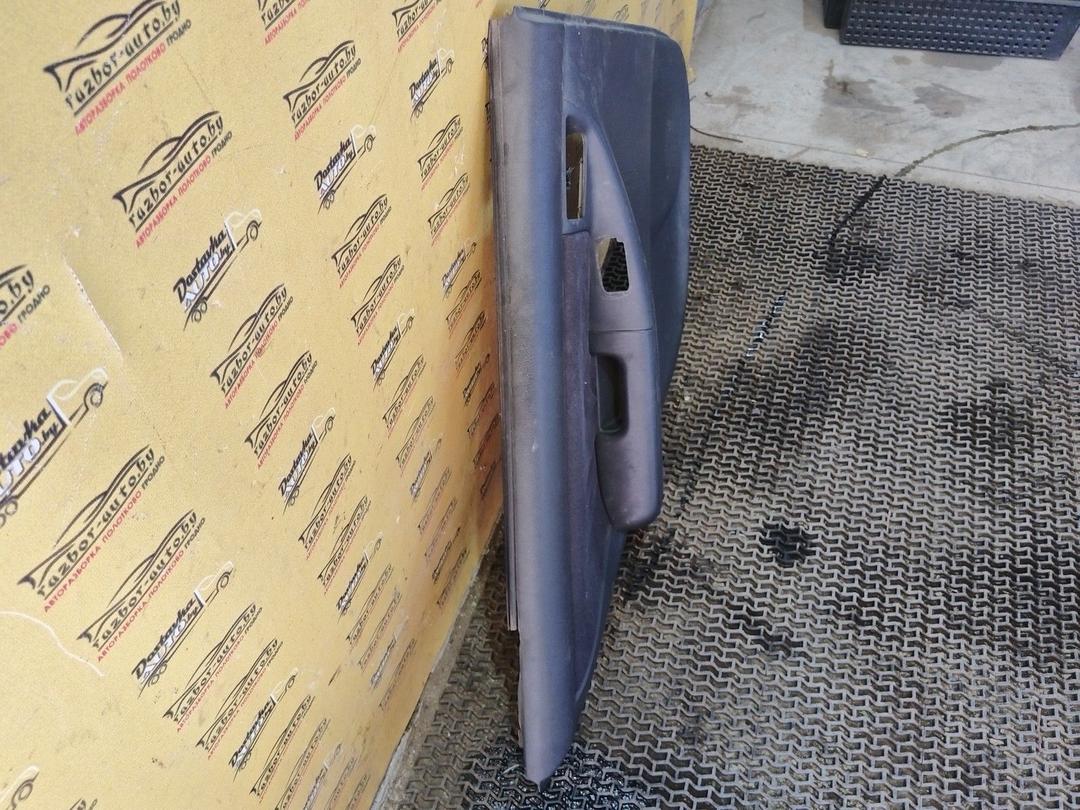 Обшивка двери задней левой (дверная карта) AXWC26 Toyota Corolla купить