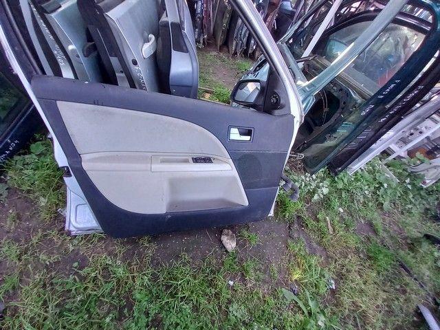 Обшивка двери передней левой (дверная карта) D38I1Z Ford Mondeo купить с доставкой