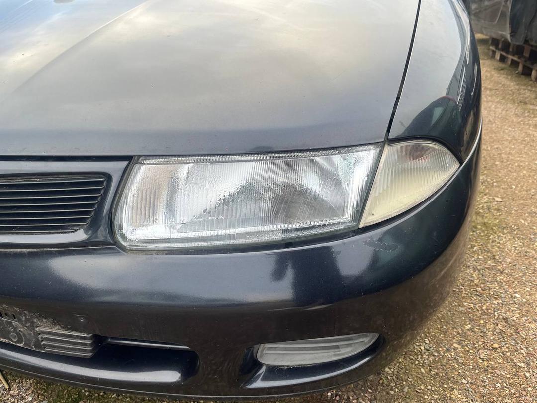 Поворотник левый AUNTE2 Mitsubishi Carisma купить