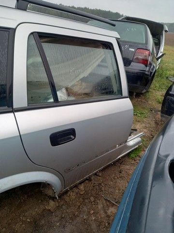 Замок двери задней правой 0J00OD Opel Astra