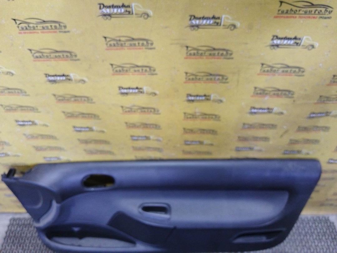 Обшивка двери передней правой (дверная карта) EFA43P Peugeot 206 купить