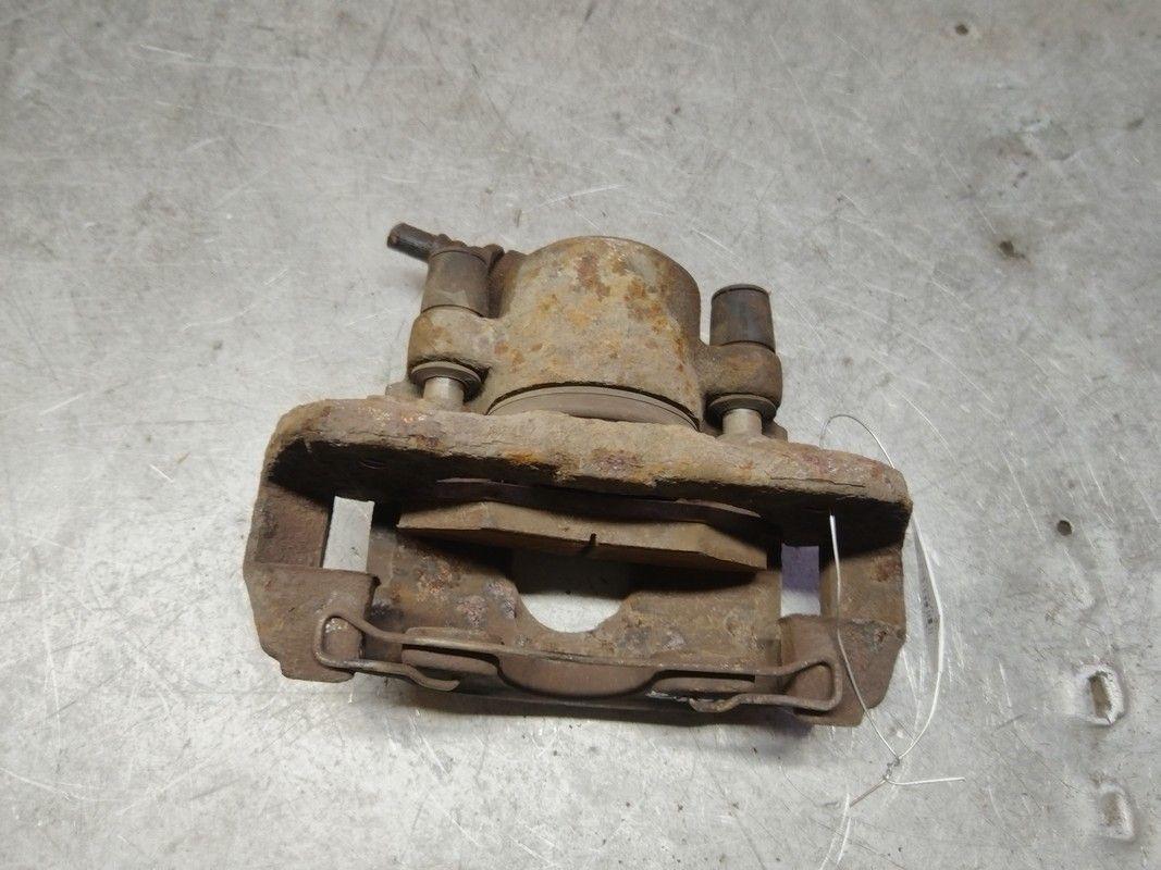 Суппорт передний левый Q1HMXZ Kia Shuma купить в магазине запчастей бу