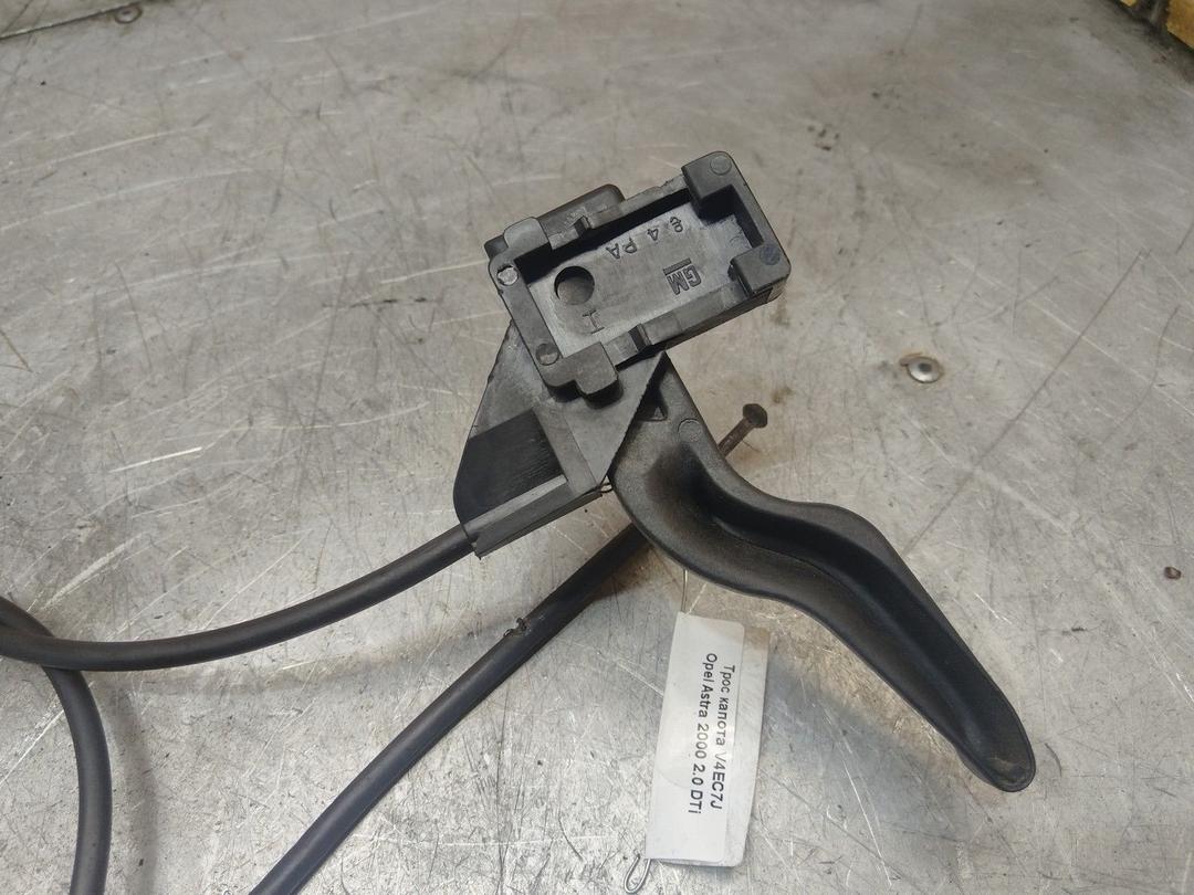 Трос капота V4EC7J Opel Astra купить в магазине запчастей бу