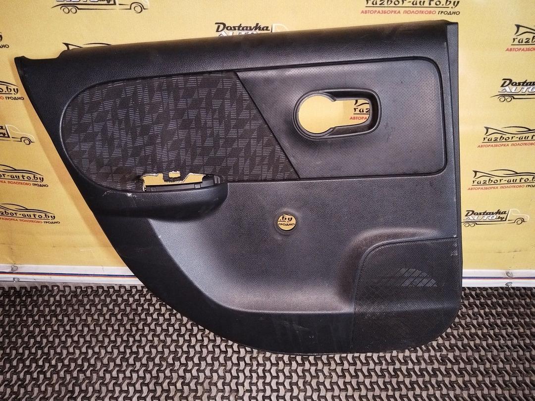 Обшивка двери задней левой (дверная карта) 93H76Z Nissan Note