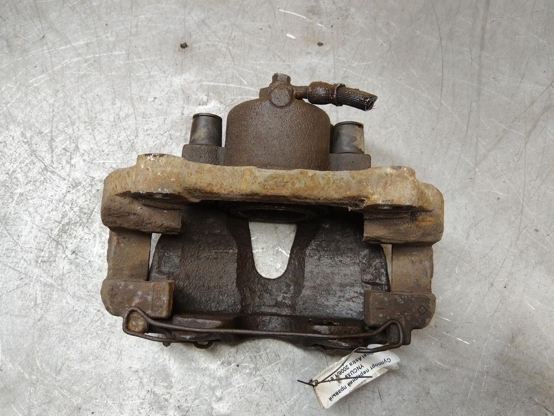 Суппорт передний правый YNCUX9 Opel Astra купить на авторазборке