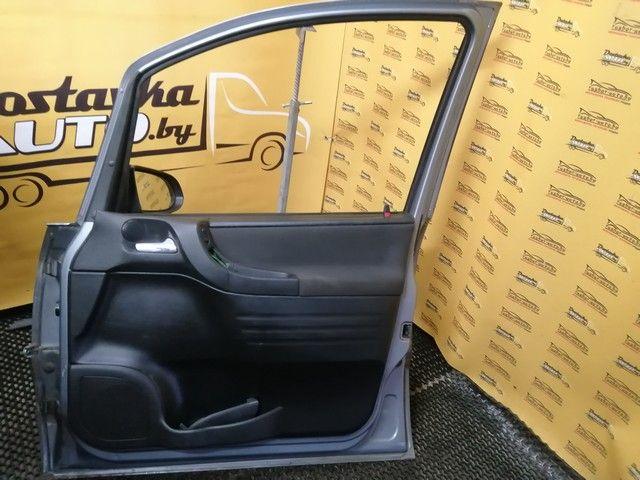 Обшивка двери передней правой (дверная карта) AKM04A Opel Zafira