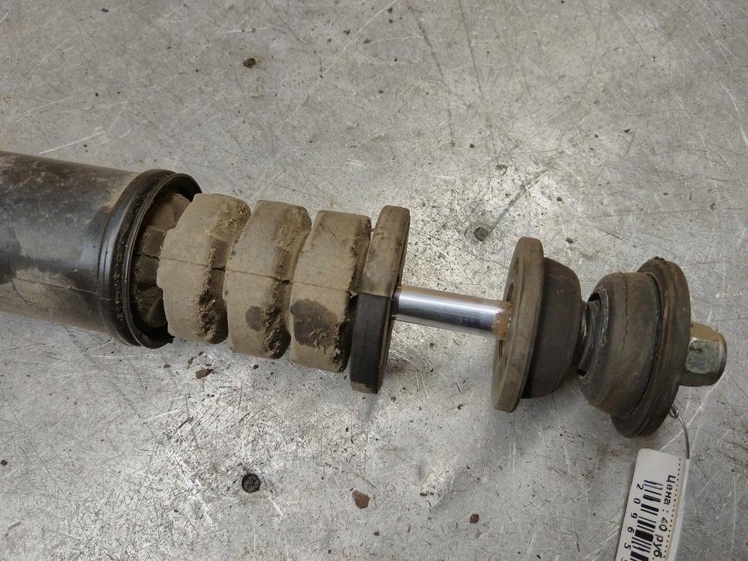 Амортизатор задний левый C6N9V9 Nissan Note купить с доставкой