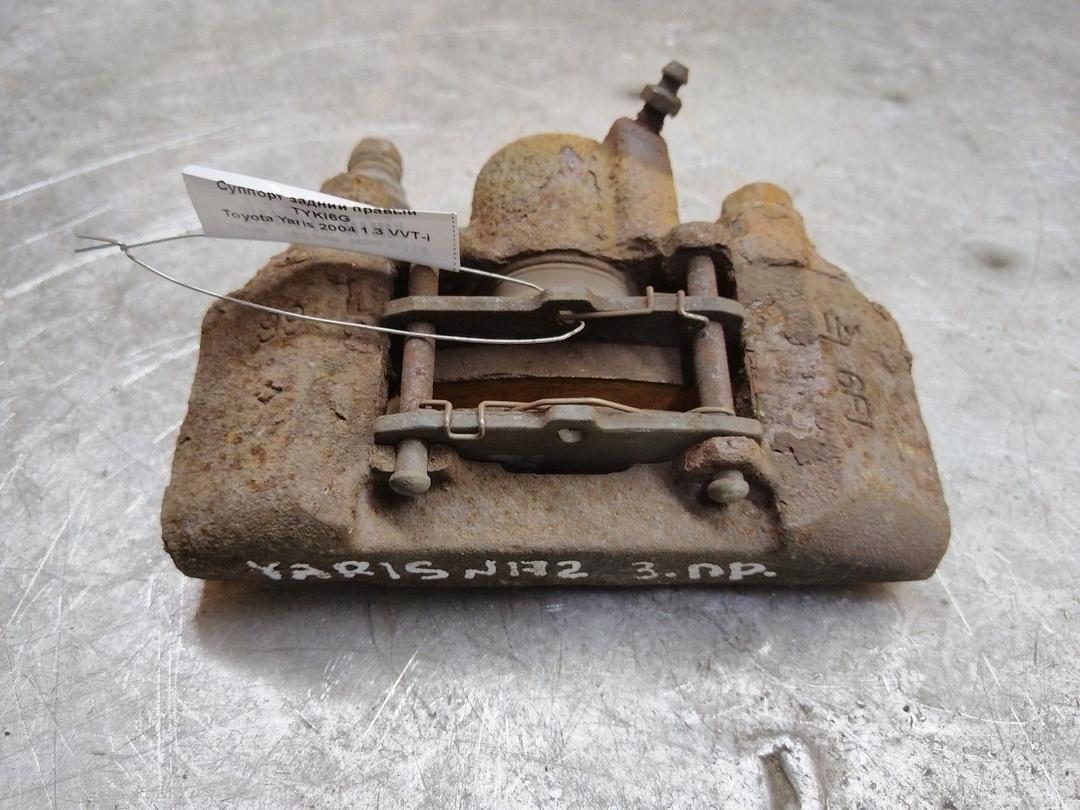 Суппорт задний правый TYKI6G Toyota Yaris - Фото 1