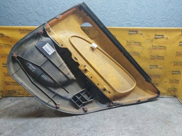 Обшивка двери задней левой (дверная карта) 13W7FK Toyota Corolla купить на авторазборке