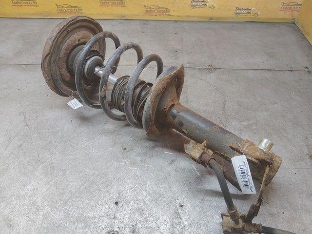 Амортизатор передний левый W9GCZG Nissan Primera - Фото 1