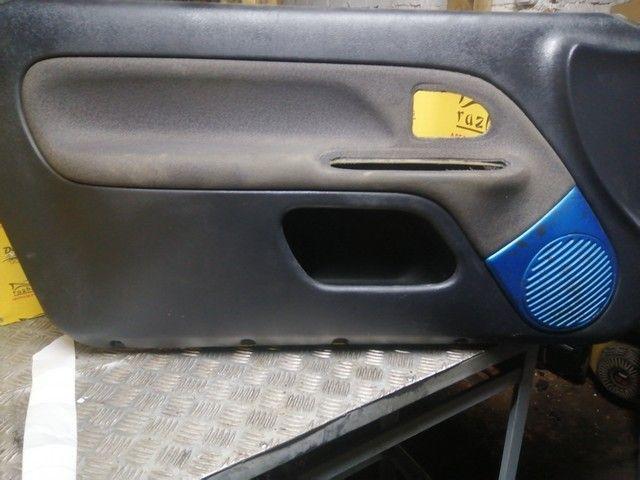Обшивка двери передней левой (дверная карта) M7R8B5 Renault Clio