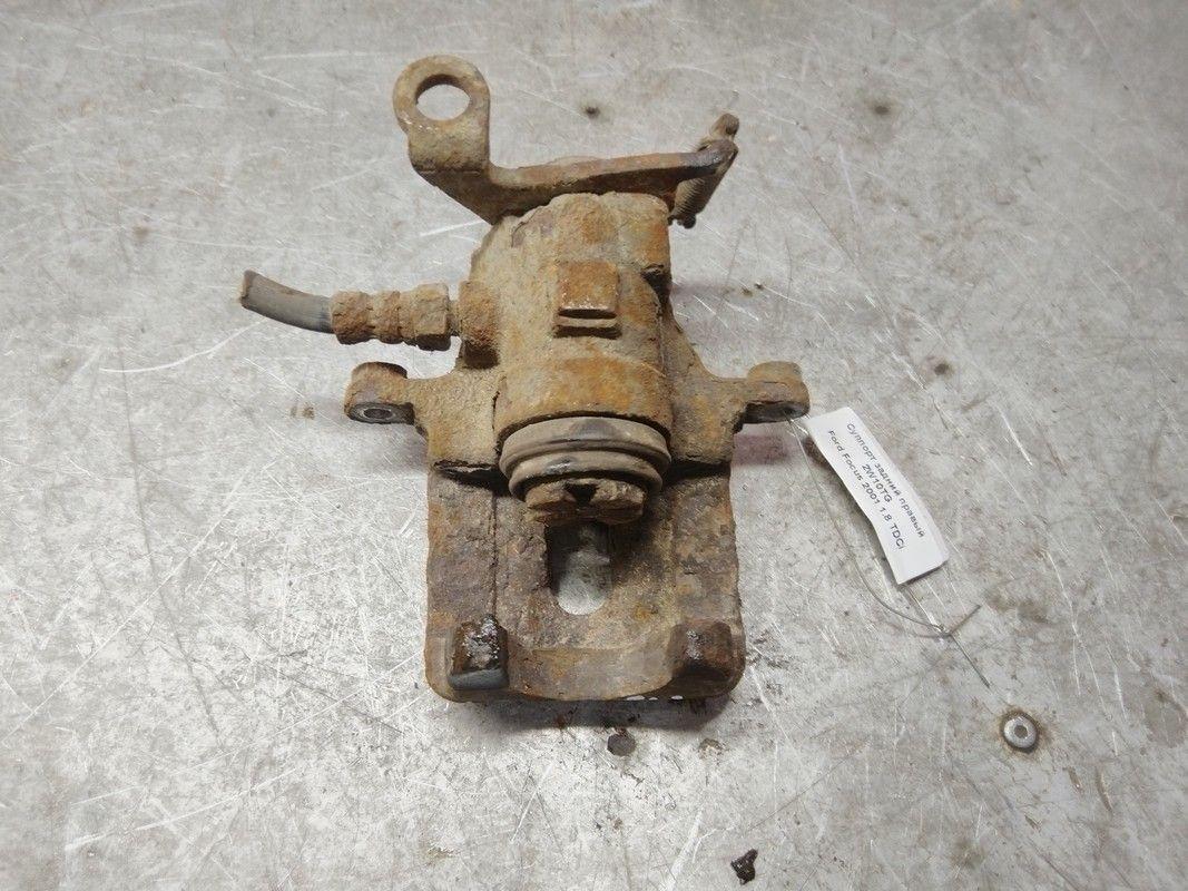 Суппорт задний правый 2W10TG Ford Focus купить в магазине запчастей бу