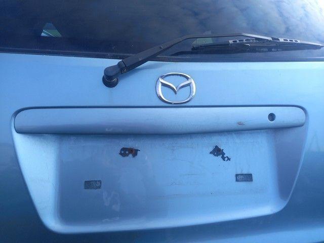 Накладка подсветки номера BIS9YX Mazda MPV - Фото 2