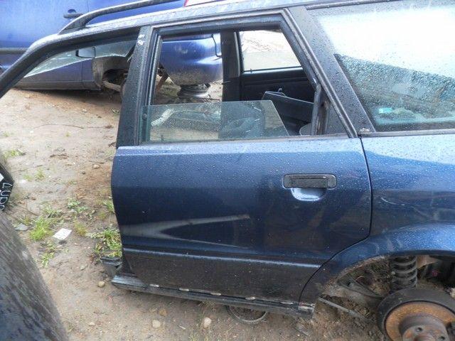 Стекло двери задней левой EYTSYB Audi 80