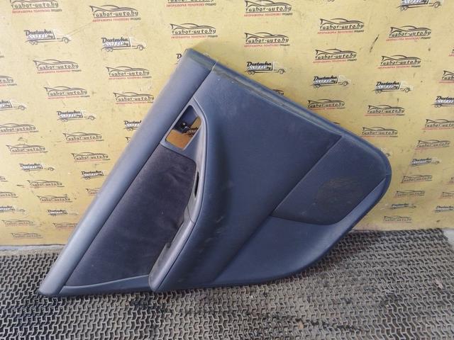 Обшивка двери задней левой (дверная карта) AXWC26 Toyota Corolla