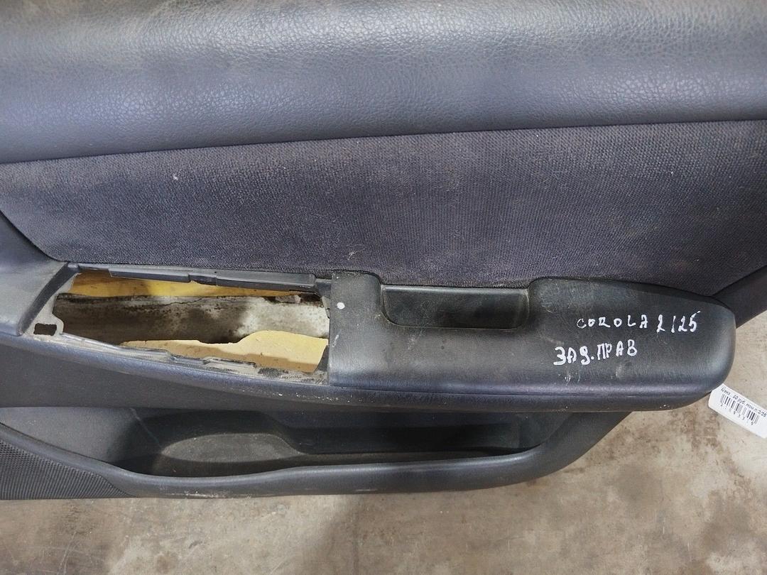 Обшивка двери передней правой (дверная карта) PS0D82 Toyota Corolla купить на авторазборке