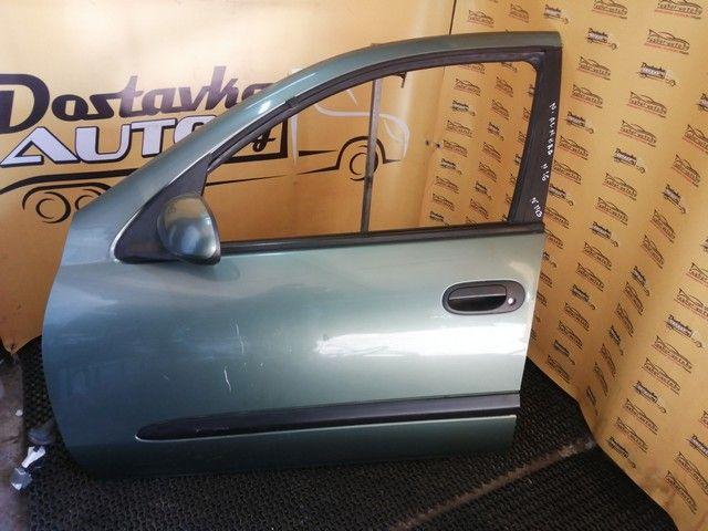 Обшивка двери передней левой (дверная карта) T76J2N Nissan Almera