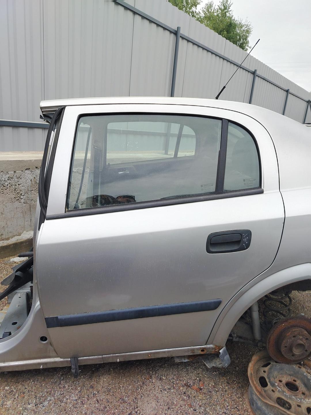 Дверь задняя левая 0RO7RG Opel Astra