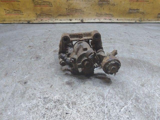 Суппорт задний левый X0WN61 Opel Astra купить в магазине запчастей бу