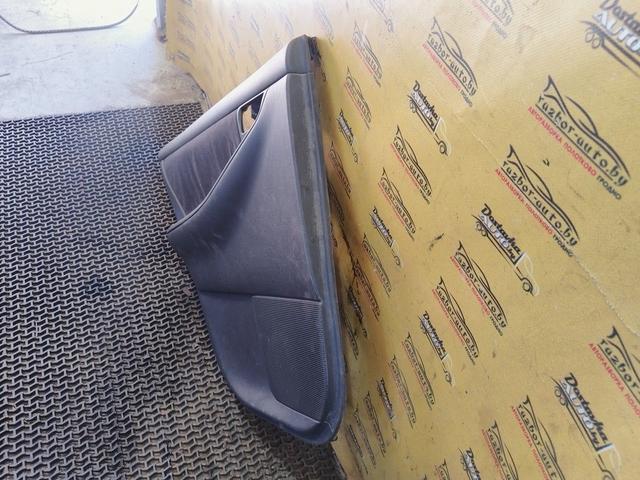 Обшивка двери задней левой (дверная карта) AXWC26 Toyota Corolla купить в магазине запчастей бу