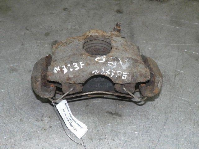 Суппорт передний левый JX25YL Mazda 323F - Фото 1