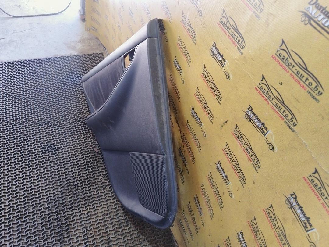 Обшивка двери задней левой (дверная карта) AXWC26 Toyota Corolla купить в магазине запчастей бу