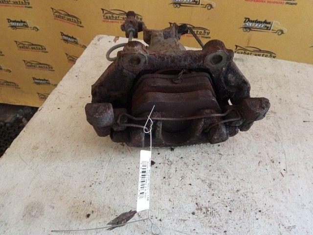 Суппорт передний левый OU94FF Audi 100 купить в магазине запчастей бу