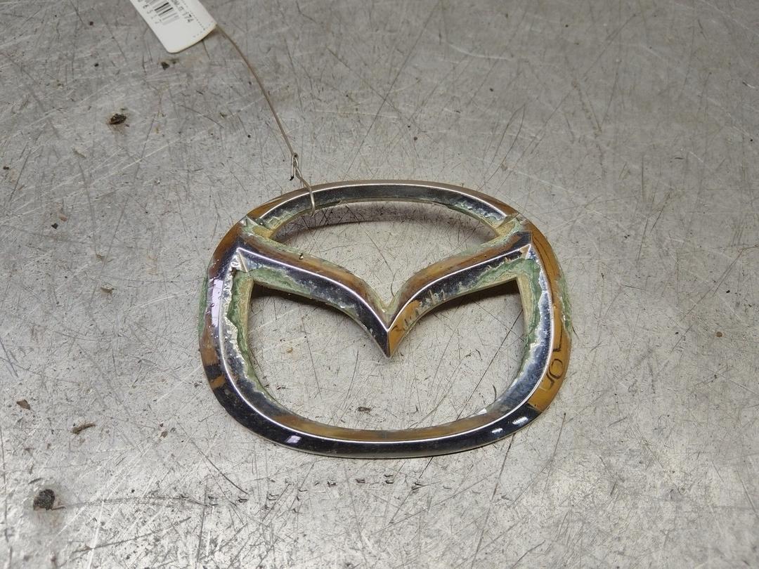 Эмблема XWONHT Mazda Premacy