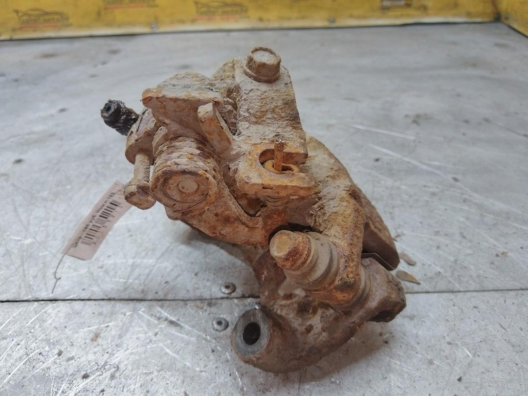 Суппорт задний левый TFJ6CG Toyota Corolla купить в магазине запчастей бу