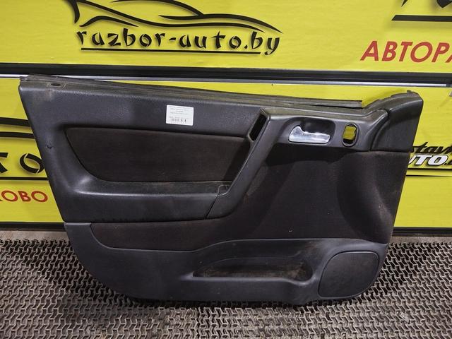 Обшивка двери передней левой (дверная карта) KWGD68 Opel Astra