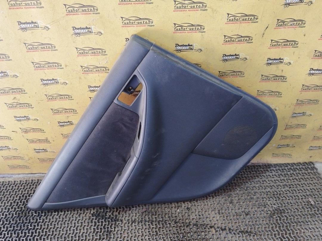 Обшивка двери задней левой (дверная карта) AXWC26 Toyota Corolla